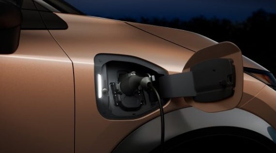 Close-up image of charging cable plugged in | Grand Blanc Nissan in Grand Blanc MI